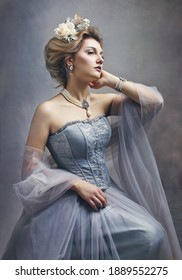 Portrait of a girl styled like an antic princess or countess dress like a paint