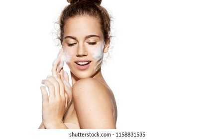 Portrait Of Girl Touching Flawless Soft Skin On White Background. Woman Using Foam For Wetting Face. Pampering And Freshness Concept. 