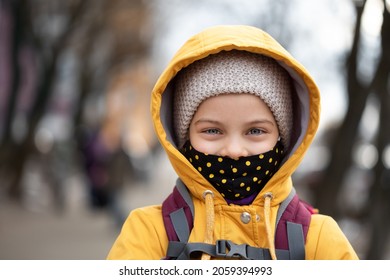 Portrait Of Girl Wearing Mask In Warm Coat In Winter