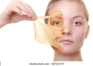 Portrait Of Girl Young Woman In Orange Facial Peel Off Mask Isolated On White. Peeling. Beauty And Body Skin Care. Studio Shot.