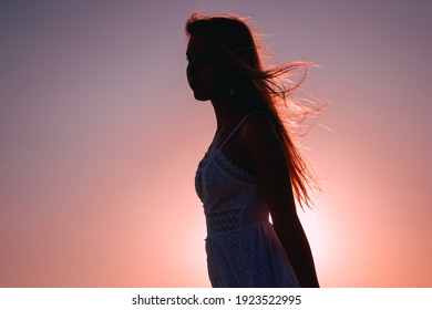 Portrait Of A Girl's Silouette On Sunset