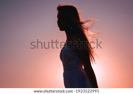 portrait of a girl's silouette on sunset