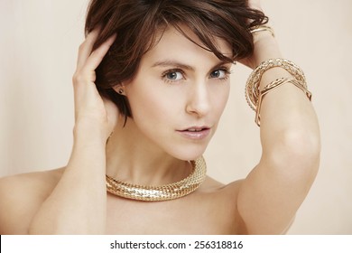 Portrait Of Glamorous Woman Wearing Gold Necklace