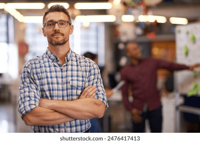 Portrait, glasses and business man with arms crossed in startup office for pride in career or job. Creative, face and confident professional entrepreneur, copywriter and employee coworking at company - Powered by Shutterstock