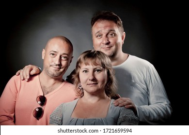 Portrait Of Good Friends In Studio - Plus Size Man, Fashionable Man And Woman Wearing Linen  Grey Dress