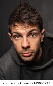 Portrait Of A Good Looking Older White Male With A Dark Background.