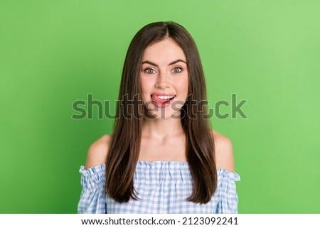 Portrait of good looking pretty female licking lips try yummy food dessert isolated on green color background