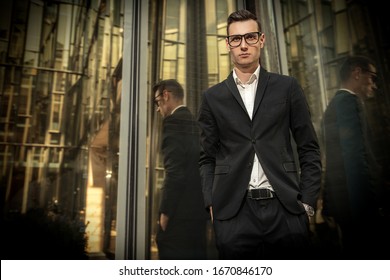 A portrait of a goodlooking young guy walking in the street. Men's beauty, fashion, business. - Shutterstock ID 1670846170