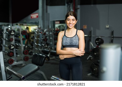 Portrait Of A Gorgeous Female Fitness Coach In Activewear Smiling While Arriving To A Modern Gym