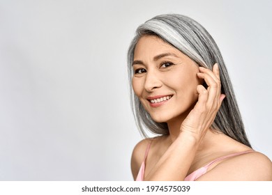 Portrait Of Gorgeous Happy Middle Aged Mature Asian Woman, Senior Older 50 Year Lady Looking At Camera Touching Her Face Isolated On White. Ads Of Lifting Anti Wrinkle Skin Care, Spa. Copy Space.