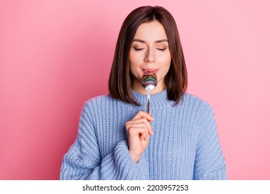 Portrait Of Gorgeous Positive Lady Closed Eyes Arm Hold Lick Spoon Isolated On Pink Color Background