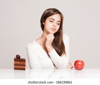 Portrait of a gorgeous young brunette woman with food.