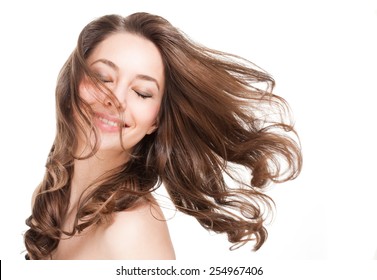 Portrait of a gorgeous young brunette woman with healthy hair.
