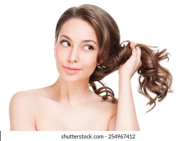 Portrait Of A Gorgeous Young Brunette Woman With Healthy Hair.