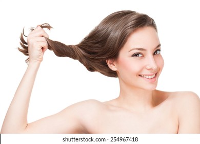 Portrait Of A Gorgeous Young Brunette Woman With Healthy Hair.