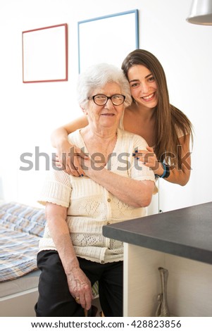 Similar – Female caretaker posing with elderly patient