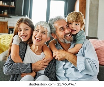 Portrait of grandparents and grandchildren having fun together at home - Powered by Shutterstock