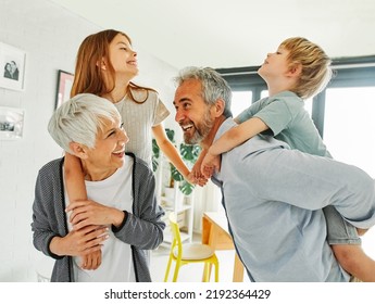 Portrait of grandparents and grandchildren having fun together at home - Powered by Shutterstock