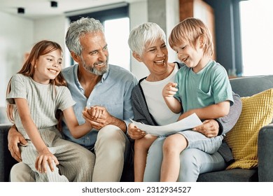 Portrait of grandparents and grandchildren having fun together at home - Powered by Shutterstock