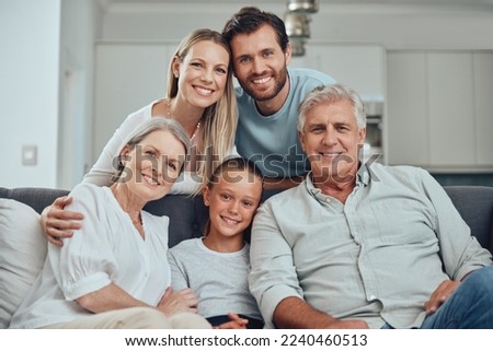 Portrait of grandparents, parents and child on sofa enjoying holiday, weekend and quality time together. Big family, love and senior couple bonding with mom, dad and girl on couch in family home