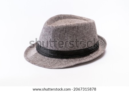 Portrait of gray fedora hat with black ribbon is a wear fot gentelman isolated on white background, classic hat
