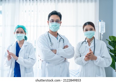 Portrait Group Of Asian Doctor And Nurse Clapping The Hands With Smile. Professional Medical Team Stand In Hospital Office Ward And Giving Encouragement To Patient People After Work In Recovery Room.