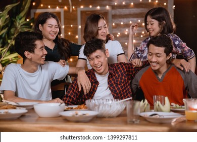 Portrait Of Group Of Asian Friend Having Dinner Party Together With Friend At Home Backyard