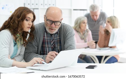 Portrait Of Group Of Business People Working At Modern Office