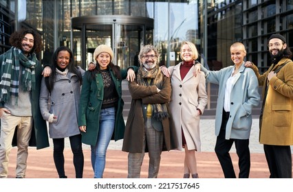 Portrait Of A Group Of Co-workers Outdoors A Corporate Office Area. High Quality Photo