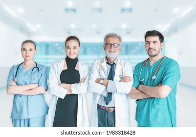 Portrait Group Of Doctors With Stethoscope In Medical Uniform Arms Crossed Posing In Front Of Examination Room, Team Physician Doctors In Patient Clinic Hospital. Doctor OccupationMedicine Healthcare