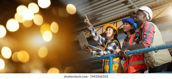 Portrait A Group Of Ethnically Diverse Engineers Or Factory Workers In Industrial Plants. Three Skilled Technicians Wearing Helmets And Safety Vests Were Chatting Or Meeting Happily For Future Goals.