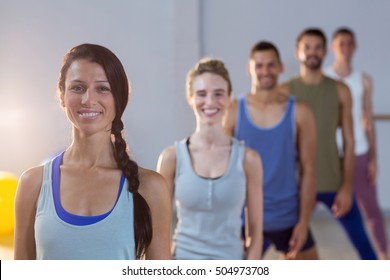 Portrait of group of fitness team posing in fitness studio - Shutterstock ID 504973708
