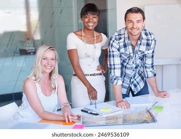 Portrait, group and happy business people at table in meeting together, cooperation or collaboration in startup. Face, creative team and designers smile at desk, diversity or brainstorming photograph - Powered by Shutterstock