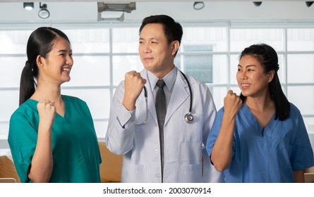 Portrait Of A Group Of Medical Staff Poses To Give Confidence And Looking Togrther In The Hospital Boardroom.