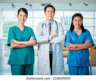 Portrait Of A Group Of Medical Staff Poses To Give Confidence And Looking Togrther In The Hospital Boardroom.