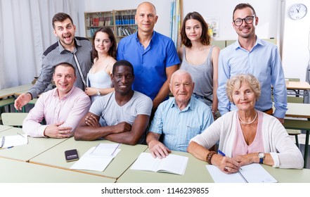 Portrait Of Group People Different Ages During Business Course In Modern Classroom