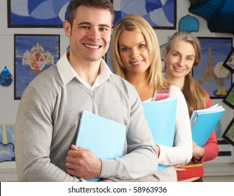 Portrait Of Group Of Teachers In Classroom