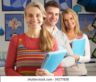 Portrait Of Group Of Teachers In Classroom