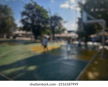 a portrait of a group of teenagers who appear to be playing on an unfocused basketball court. blurred background of basketball court - Powered by Shutterstock