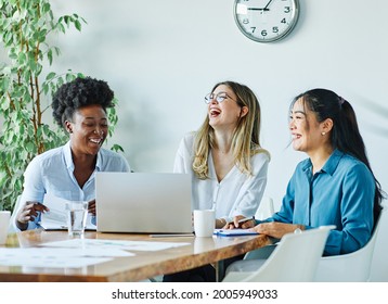 Portrait of a group of youn happy people in a start up office - Shutterstock ID 2005949033
