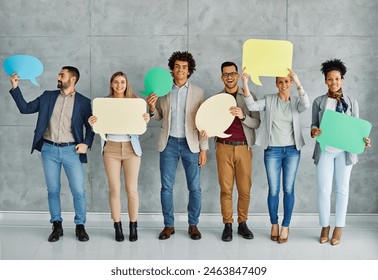 Portrait of a group of young business people in office. Speech bubble, team and comment by business people holding sign, news and voice icon feeling excited on social media. Group, opinion and poll  - Powered by Shutterstock