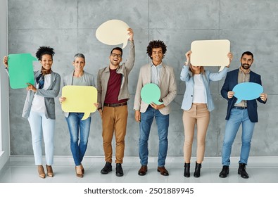 Portrait of a group of young business people in office. Speech bubble, team and comment by business people holding sign, news and voice icon feeling excited on social media. Group, opinion and poll  - Powered by Shutterstock