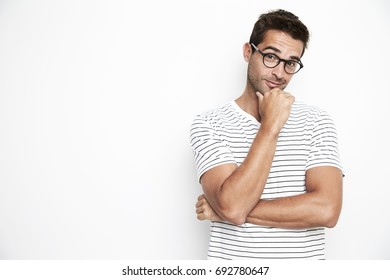 Portrait of guy in glasses, thinking