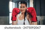 Portrait, gym and boxing glove with training, woman and practice for match and sports with endurance. Challenge, fighter or boxer with workout or girl in fitness centre or progress with health