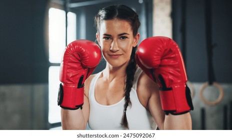 Portrait, gym and boxing glove with training, woman and practice for match and sports with endurance. Challenge, fighter or boxer with workout or girl in fitness centre or progress with health - Powered by Shutterstock