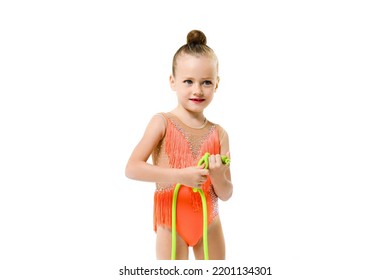 Portrait Of Gymnast Little Girl With Jumping Rope In Bright Festive Leotard And Makeup, Doll Face Of Sportive Smiling Child