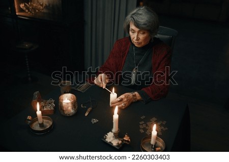 Portrait of gypsy fortune teller looking at camera