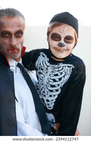 Portrait, halloween and costume with a father and his son outdoor for a trick or treat tradition together. Family, horror or spook with a parent and child in an outfit for celebration in the holidays