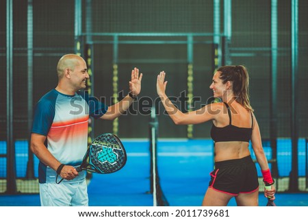 Portrait of handshake of two padel tennis players
