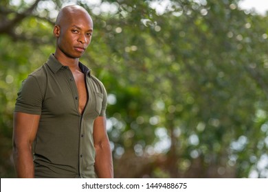 Portrait Of A Handsome 30 Year Old Black Man Posing With Shoulder Towards The Camera